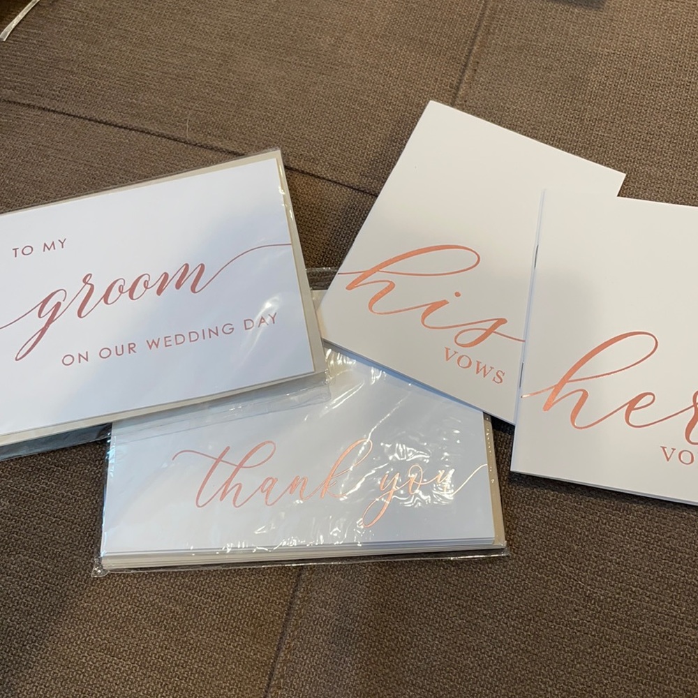 Bundle of wedding cards and vow books for bride and groom